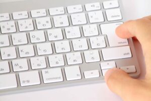 The manifold costs of being a non-native English speaker in science
